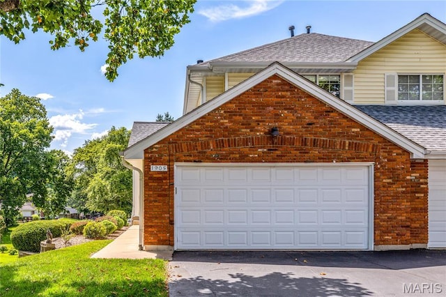 1905 King Arthur Ct, Maryland Heights Township, MO 63146 - garage featuring asphalt driveway