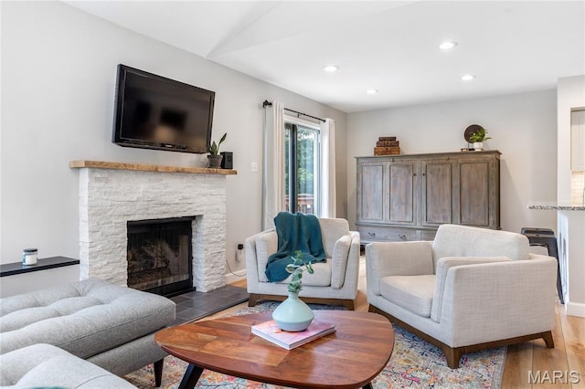 1905 King Arthur Ct, Maryland Heights Township, MO 63146 - living area featuring wood finished floors, recessed lighting, and a stone fireplace