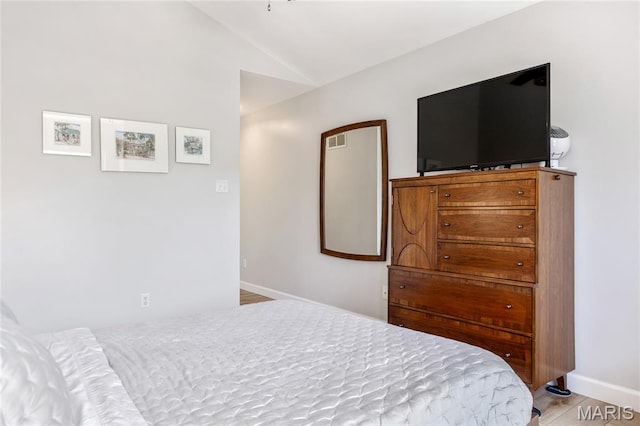 1905 King Arthur Ct, Maryland Heights Township, MO 63146 - bedroom with lofted ceiling and baseboards