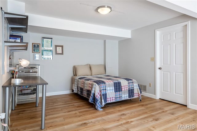 1905 King Arthur Ct, Maryland Heights Township, MO 63146 - bedroom featuring light wood-type flooring and baseboards