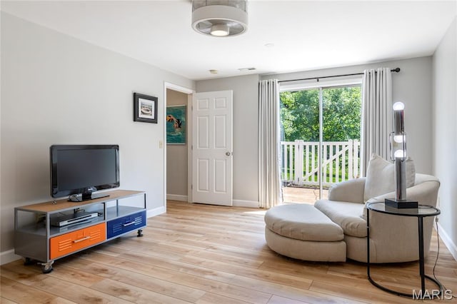 1905 King Arthur Ct, Maryland Heights Township, MO 63146 - living room featuring light wood-type flooring and baseboards