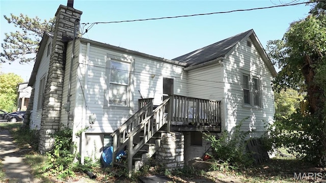 6401 Margaret, Saint Louis, MO 63121 - view of property exterior with a chimney and a wooden deck