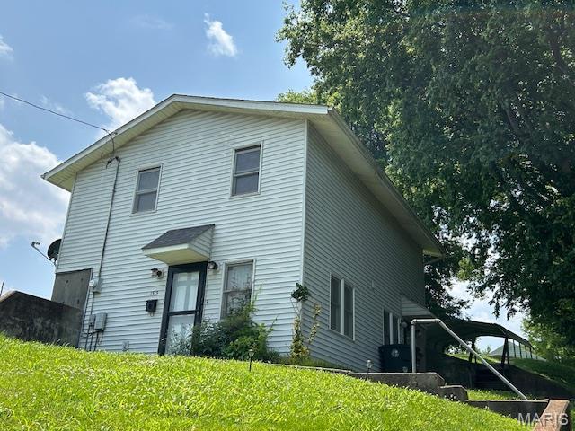 1515 N Water St, Cape Girardeau, MO 63701 - view of front facade featuring a front yard