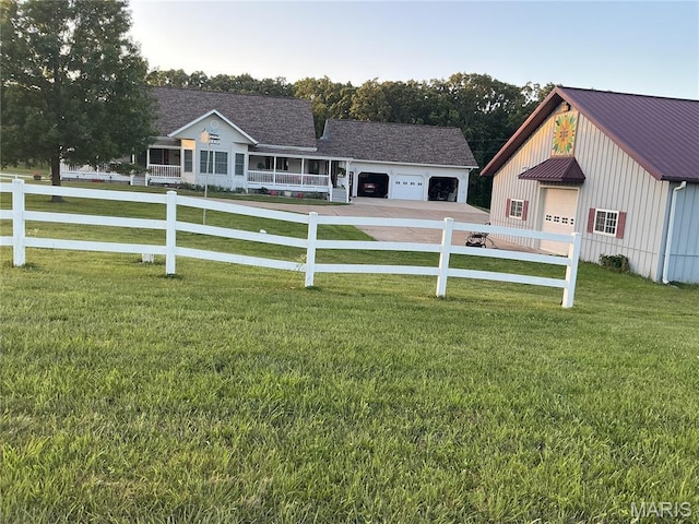 11996 County Road 3290, Rolla, MO 65401 - view of yard featuring concrete driveway and a garage