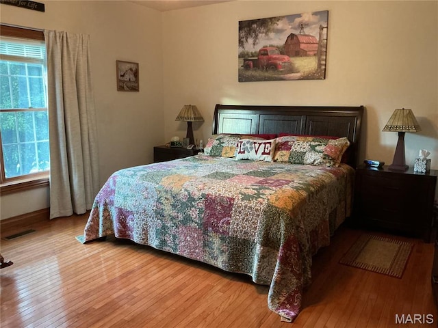 11996 County Road 3290, Rolla, MO 65401 - bedroom with light wood-style flooring and baseboards