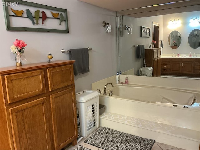 11996 County Road 3290, Rolla, MO 65401 - bathroom featuring tile patterned flooring, a garden tub, and vanity