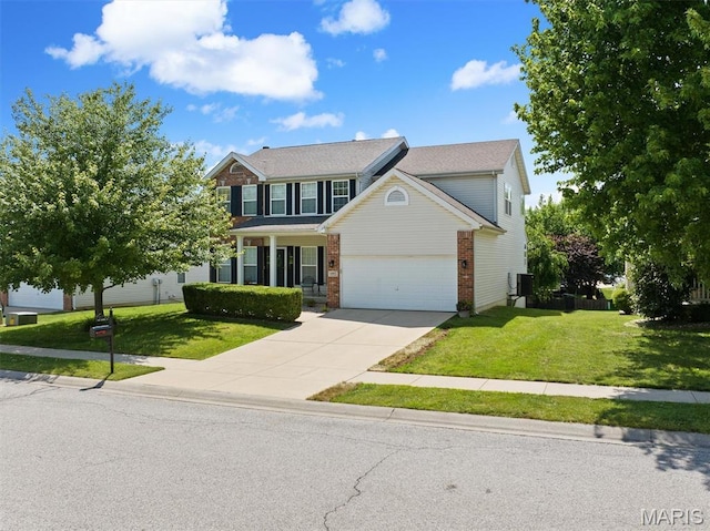 6817 Dunhill Dr, Fairview Heights, IL 62208 - view of front of house with brick siding, a front lawn, driveway, and an attached garage