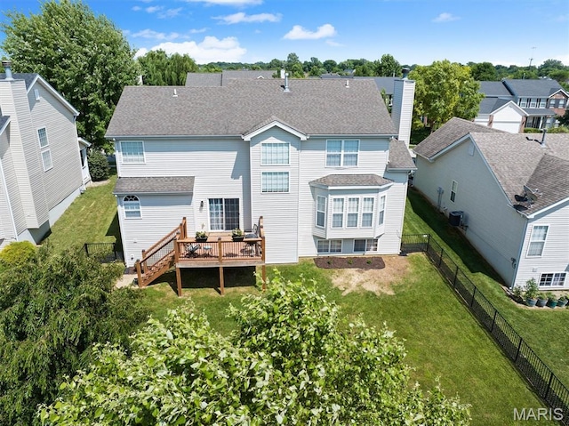 6817 Dunhill Dr, Fairview Heights, IL 62208 - back of property featuring a fenced backyard, a deck, a chimney, a shingled roof, and a residential view