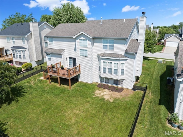6817 Dunhill Dr, Fairview Heights, IL 62208 - rear view of house with a deck, a shingled roof, and a chimney