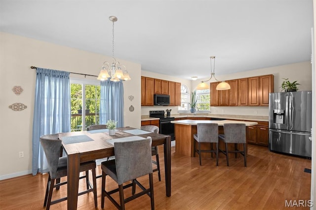 6817 Dunhill Dr, Fairview Heights, IL 62208 - dining room featuring a chandelier and wood finished floors