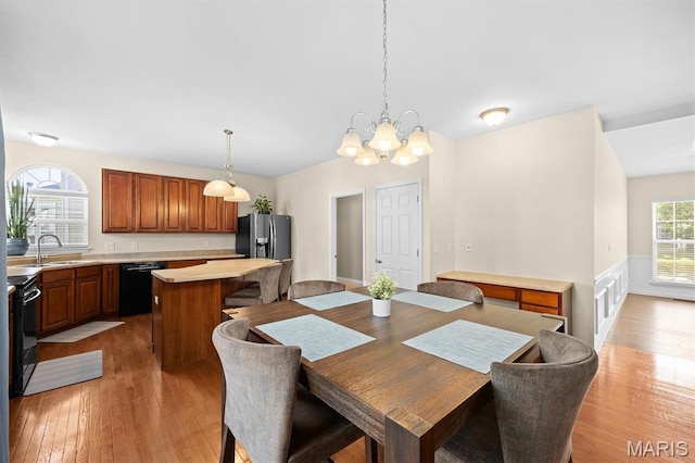 6817 Dunhill Dr, Fairview Heights, IL 62208 - dining area with a chandelier and light wood finished floors