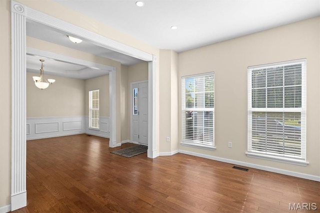 6817 Dunhill Dr, Fairview Heights, IL 62208 - empty room featuring wood finished floors, a chandelier, recessed lighting, and a wainscoted wall