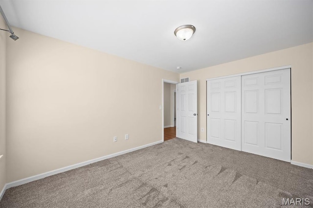 6817 Dunhill Dr, Fairview Heights, IL 62208 - unfurnished bedroom featuring carpet flooring and a closet