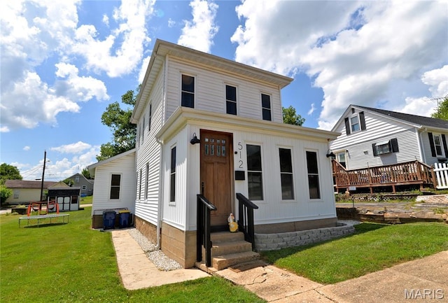 512 S 5th St, De Soto, MO 63020 - view of front of home featuring entry steps, a front yard, and a wooden deck