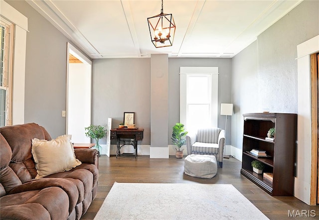 512 S 5th St, De Soto, MO 63020 - living area featuring dark wood-style floors and a chandelier
