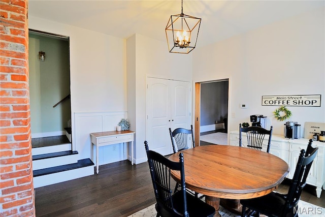 512 S 5th St, De Soto, MO 63020 - dining space with a chandelier, dark wood-style flooring, and stairway