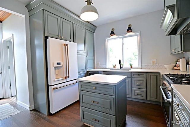 512 S 5th St, De Soto, MO 63020 - kitchen featuring white refrigerator with ice dispenser, gray cabinets, high end stove, exhaust hood, and light countertops