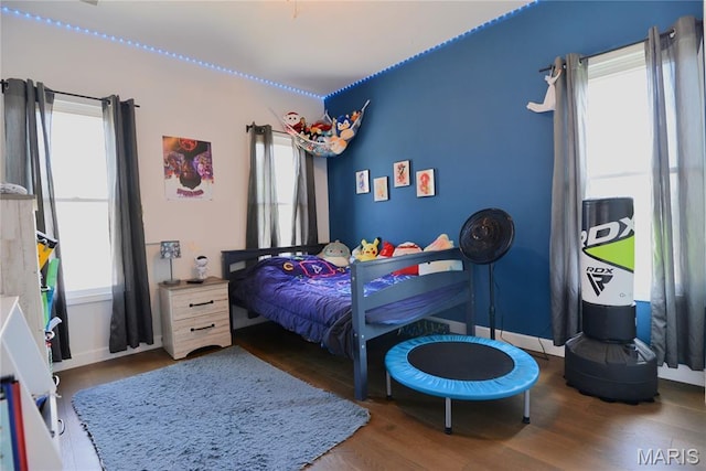 512 S 5th St, De Soto, MO 63020 - bedroom featuring wood finished floors and baseboards
