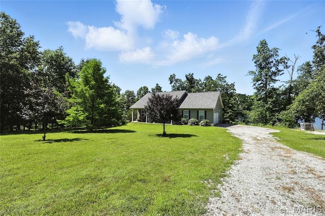 92 Lake Front Pt, Perryville, MO 63775 - view of front of home featuring driveway, a front lawn, and an attached garage