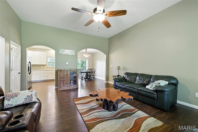 92 Lake Front Pt, Perryville, MO 63775 - living area featuring arched walkways, a ceiling fan, and dark wood-style flooring