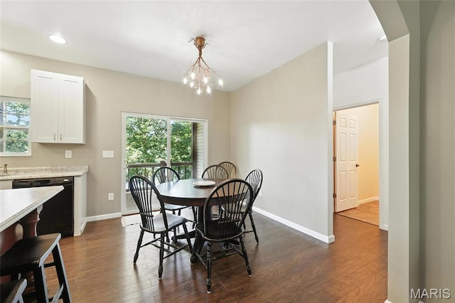 92 Lake Front Pt, Perryville, MO 63775 - dining area featuring dark wood-type flooring, healthy amount of natural light, a chandelier, arched walkways, and recessed lighting