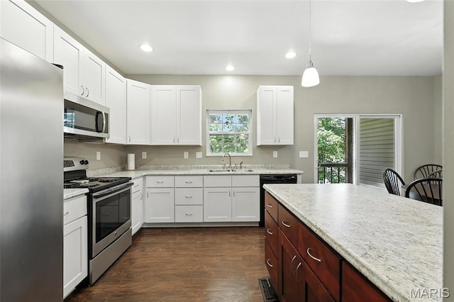 92 Lake Front Pt, Perryville, MO 63775 - kitchen with stainless steel appliances, white cabinetry, recessed lighting, dark wood-style floors, and hanging light fixtures
