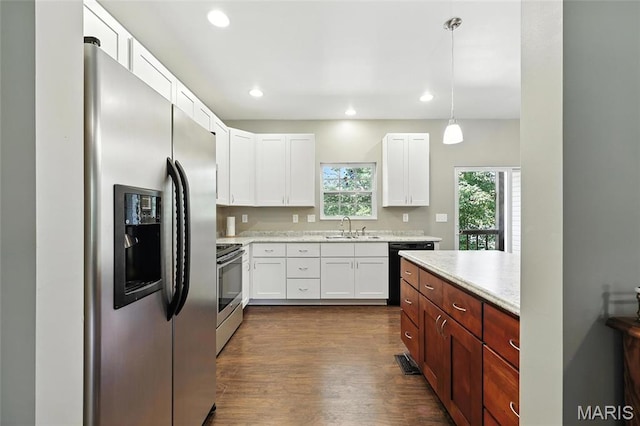 92 Lake Front Pt, Perryville, MO 63775 - kitchen with stainless steel appliances, dark wood-style flooring, white cabinetry, recessed lighting, and hanging light fixtures