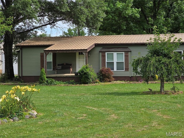 402 Il Route 143, Pocahontas, IL 62275 - single story home with covered porch, a front yard, and a metal roof