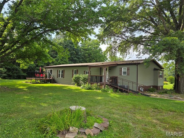 402 Il Route 143, Pocahontas, IL 62275 - back of house with a wooden deck and a lawn