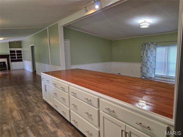 402 Il Route 143, Pocahontas, IL 62275 - kitchen with a textured ceiling, butcher block countertops, white cabinetry, ornamental molding, and open floor plan
