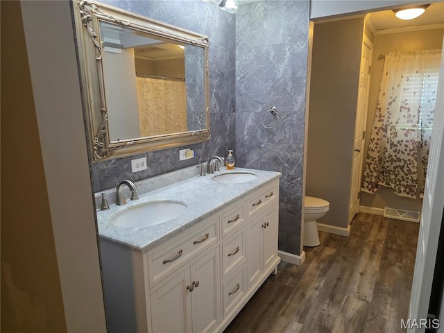 402 Il Route 143, Pocahontas, IL 62275 - bathroom featuring double vanity, crown molding, and wood finished floors