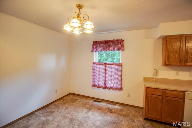 2933 Forest Dr, Alton, IL 62002 - unfurnished dining area with a chandelier and baseboards
