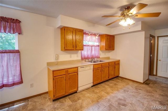 2933 Forest Dr, Alton, IL 62002 - kitchen featuring white dishwasher, plenty of natural light, brown cabinetry, and light countertops