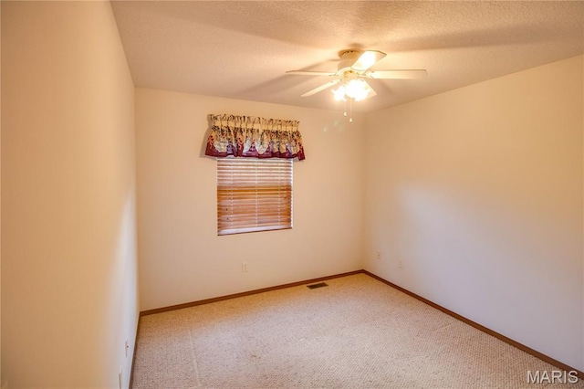 2933 Forest Dr, Alton, IL 62002 - unfurnished room featuring a ceiling fan, carpet, and a textured ceiling