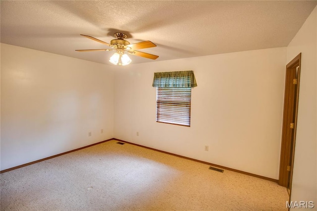 2933 Forest Dr, Alton, IL 62002 - unfurnished room with carpet, a ceiling fan, and a textured ceiling