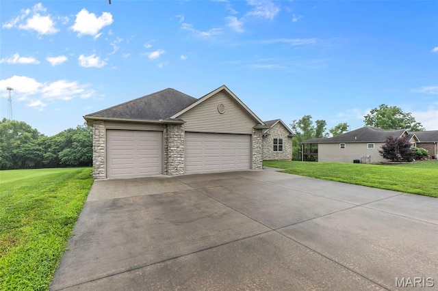 226 Indian Springs Dr, Jackson, MO 63755 - view of front of property with a front yard, stone siding, concrete driveway, and a garage