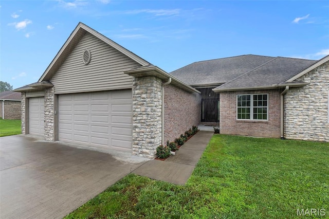 226 Indian Springs Dr, Jackson, MO 63755 - single story home with a garage, driveway, stone siding, and a front lawn