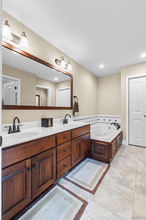 226 Indian Springs Dr, Jackson, MO 63755 - bathroom featuring double vanity, a tub with jets, and recessed lighting