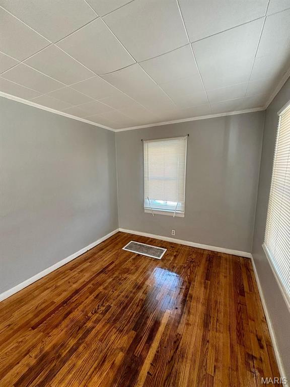 10109 Imperial Dr, Saint Louis, MO 63136 - unfurnished room featuring crown molding and wood finished floors