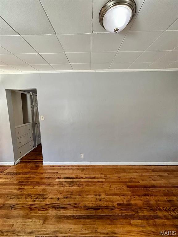 10109 Imperial Dr, Saint Louis, MO 63136 - spare room with baseboards and wood finished floors