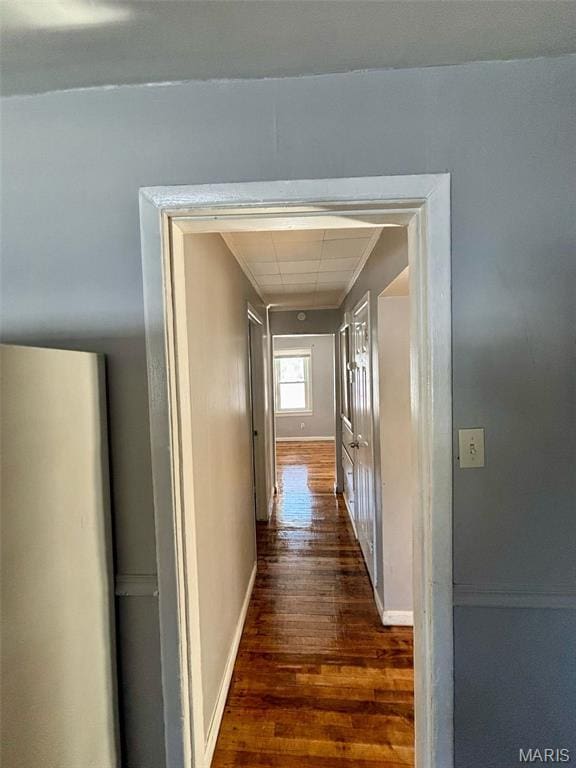 10109 Imperial Dr, Saint Louis, MO 63136 - hall featuring dark wood-type flooring and baseboards