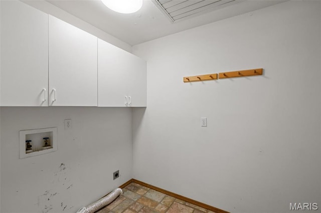 976 Aspenetter Dr, Innsbrook, MO 63390 - laundry area with cabinet space, hookup for an electric dryer, washer hookup, light stone finish flooring, and attic access