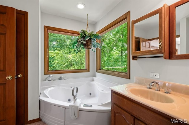 976 Aspenetter Dr, Innsbrook, MO 63390 - full bath featuring healthy amount of natural light, vanity, and a tub with jets