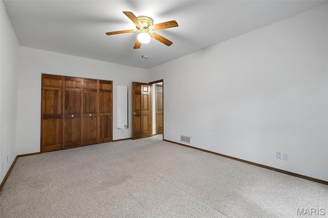 976 Aspenetter Dr, Innsbrook, MO 63390 - unfurnished bedroom with carpet, a closet, and a ceiling fan