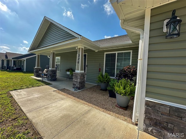 326 Apple Park Way, Poplar Bluff, MO 63901 - property entrance featuring a porch and a lawn