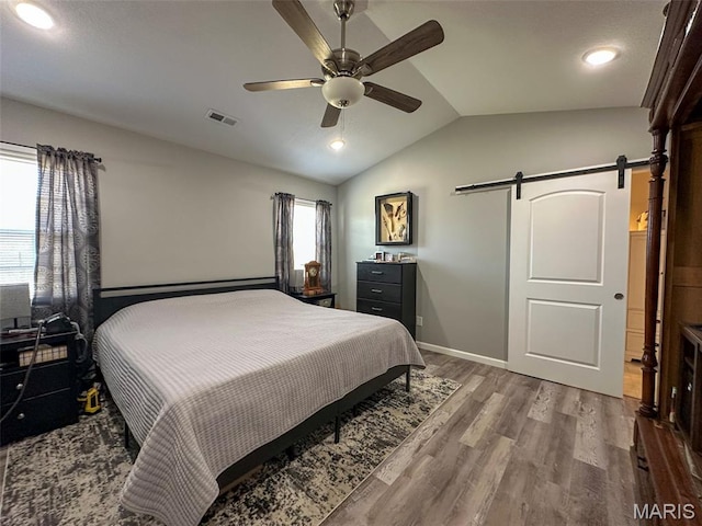 326 Apple Park Way, Poplar Bluff, MO 63901 - bedroom with a barn door, lofted ceiling, wood finished floors, ceiling fan, and recessed lighting