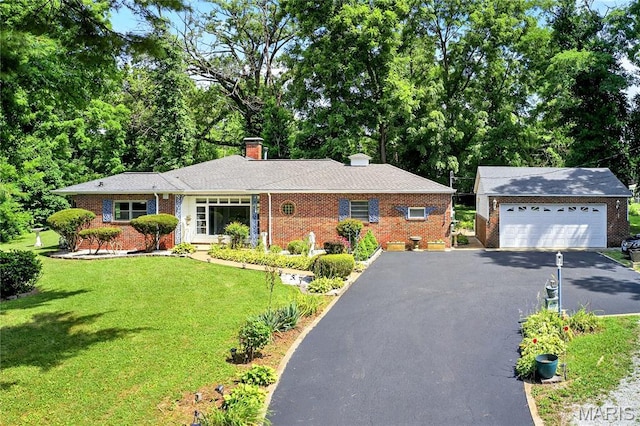 351 N 66th St, Belleville, IL 62223 - ranch-style home featuring brick siding, a chimney, a front lawn, an outdoor structure, and a detached garage