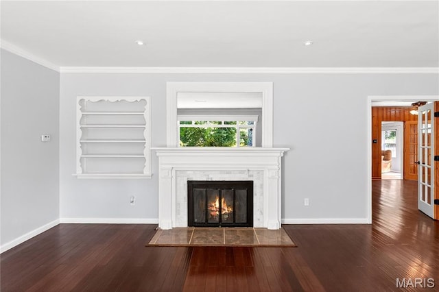 351 N 66th St, Belleville, IL 62223 - unfurnished living room with a fireplace with flush hearth, crown molding, wood finished floors, and french doors