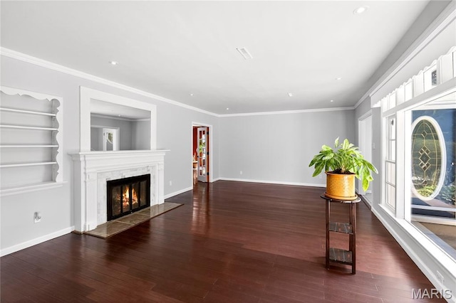 351 N 66th St, Belleville, IL 62223 - unfurnished living room featuring healthy amount of natural light, wood finished floors, a fireplace, recessed lighting, and crown molding