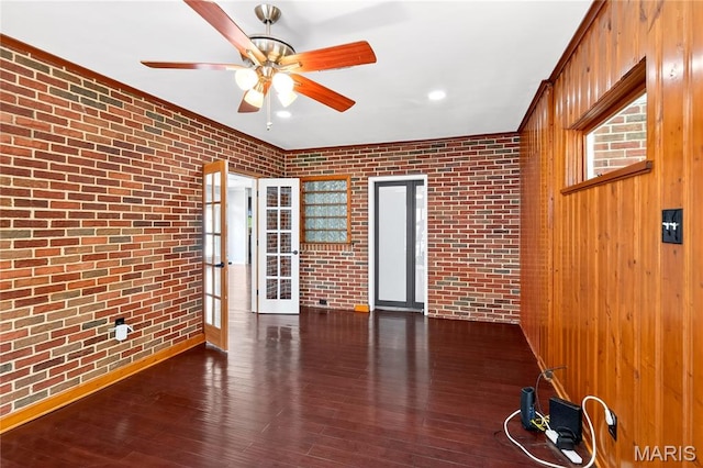 351 N 66th St, Belleville, IL 62223 - unfurnished room featuring brick wall, ceiling fan, hardwood / wood-style flooring, and french doors